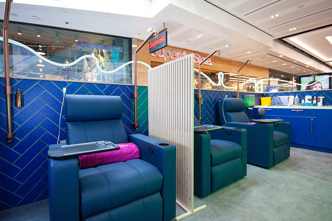 Get a Drip Westfield Stratford City blue recliner chairs with blue panel walls